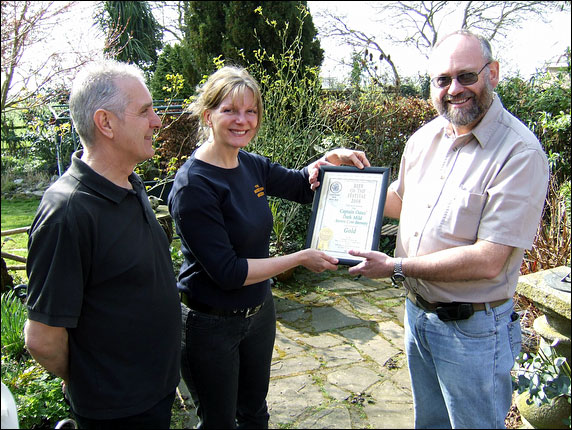 presentation of certificate to Sue Simpson