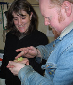 Head Brewer and Kim looking at Hops