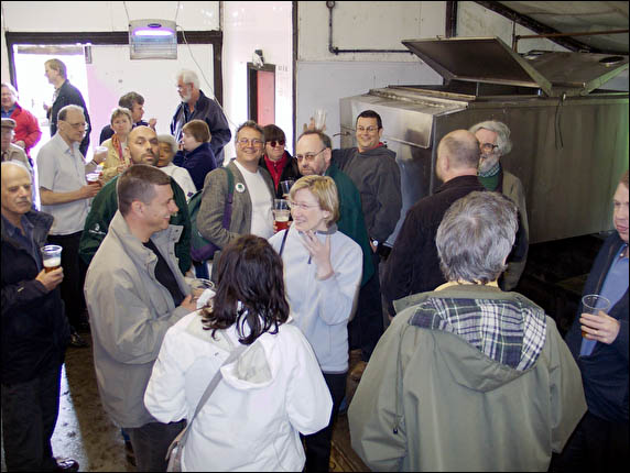 CAMRA group sampling beer in brewery