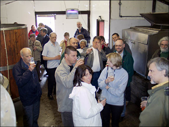 CAMRA group sampling beer in brewery
