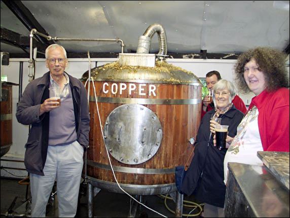 CAMRA group sampling beer in brewery