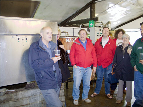 CAMRA group sampling beer in brewery