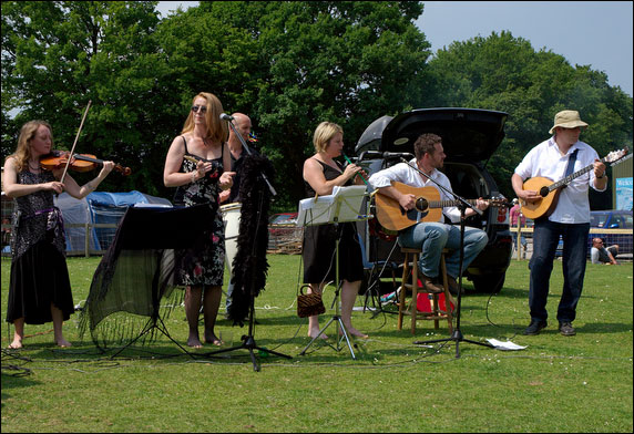 The Folk Group outside on the grass