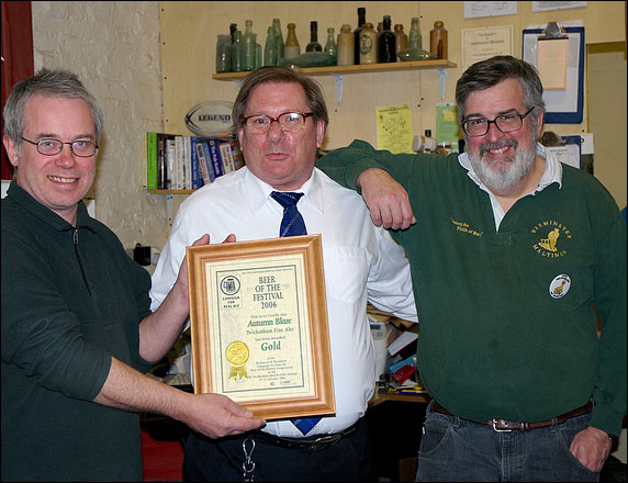 Steve Brown and Tom Madeiros receiving Certificate from Brian Kirton