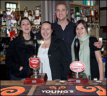 Staff behind bar