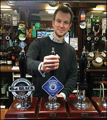 Frances pulling first pint at the EUSC