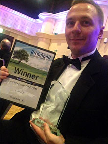 Stuart holding award for Best Small Business 2014